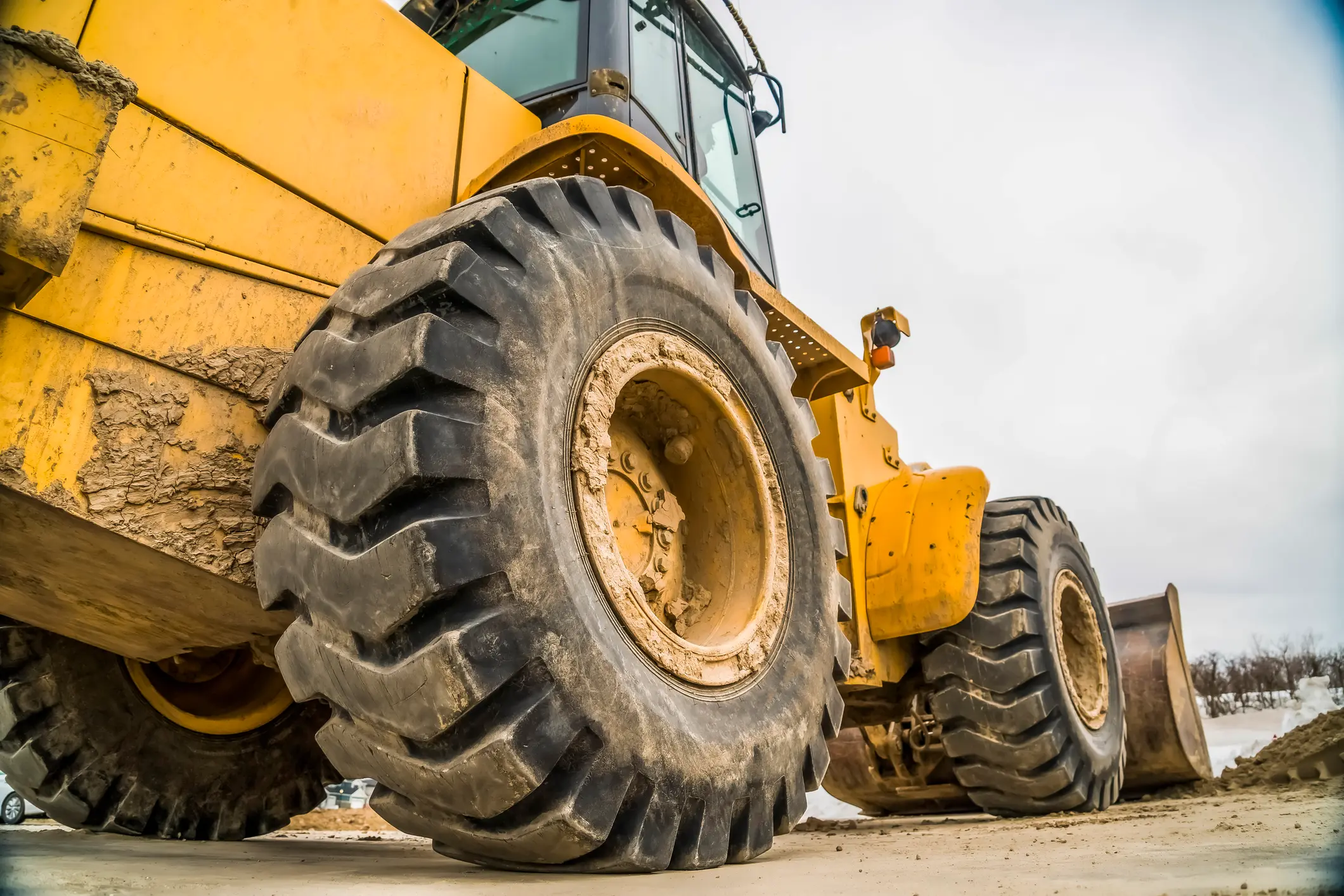 A close up of the wheel system on construction equipment